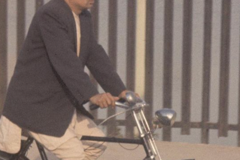 A government official riding a bicycle in the 1960s. (Photo: University of Hawaii, Manoa)